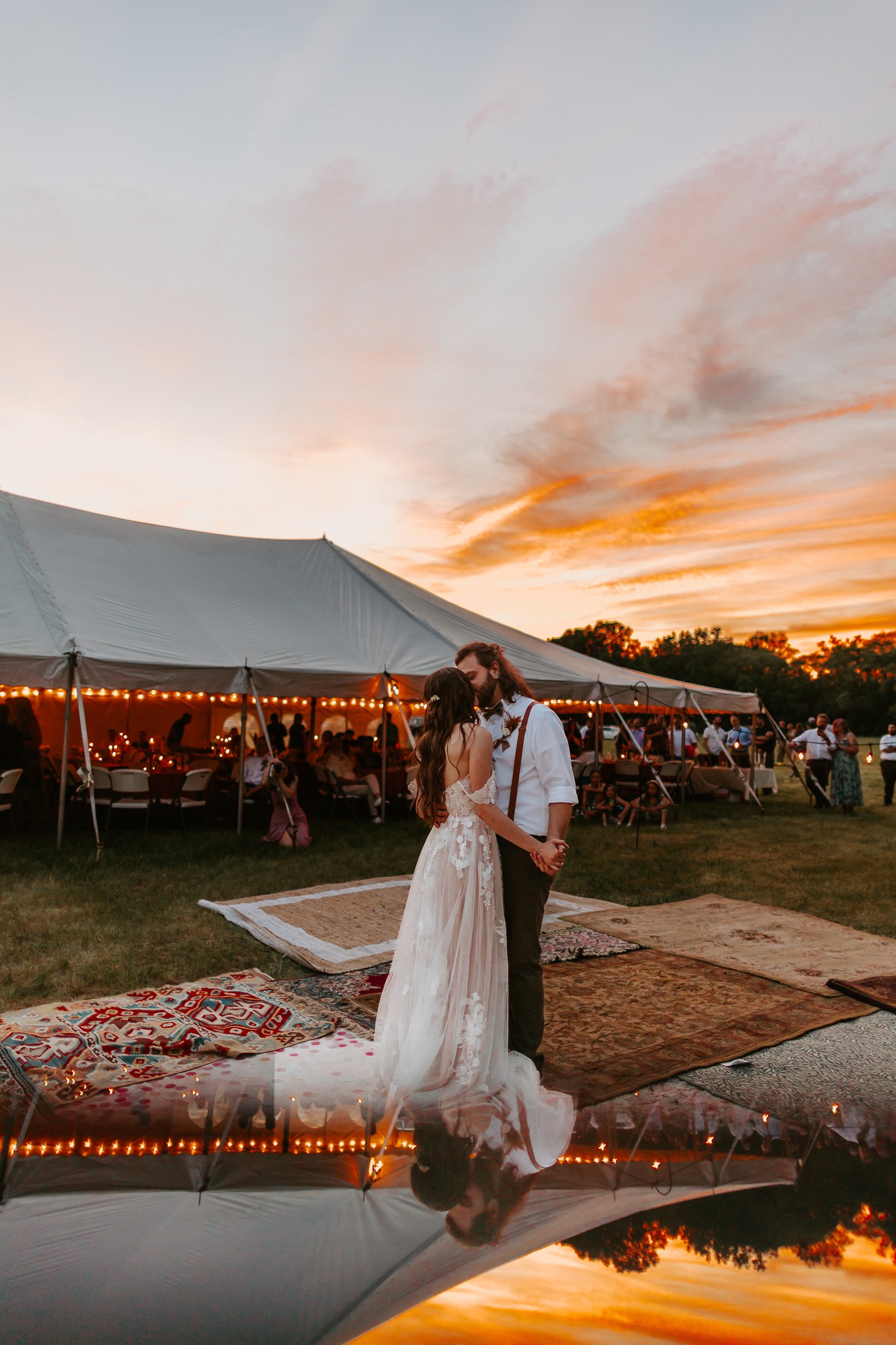 bride and groom dancing at sunset at wedding reception