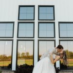 bride and groom outside hidden acre wedding venue