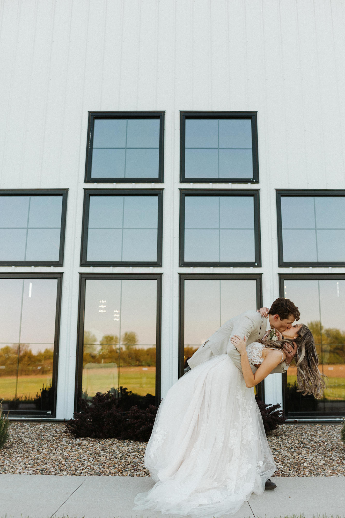 bride and groom outside hidden acre wedding venue