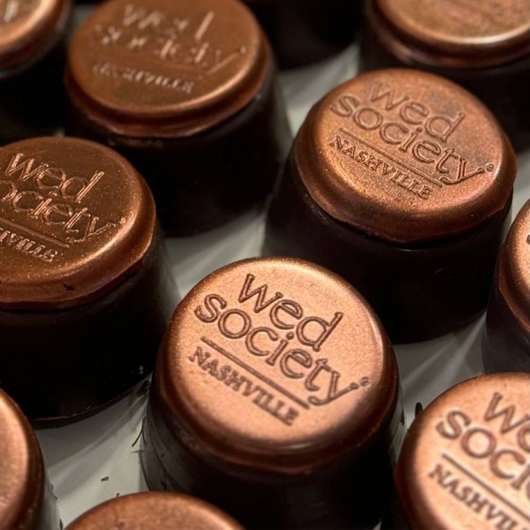 Copper-lid mason jars with Wed Society Nashville branding for wedding favors