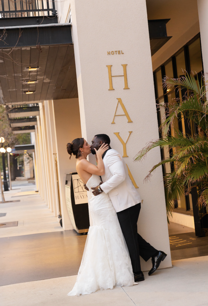 Bride and Groom kissing in front of Hotel Haya in Ybor City, Fl