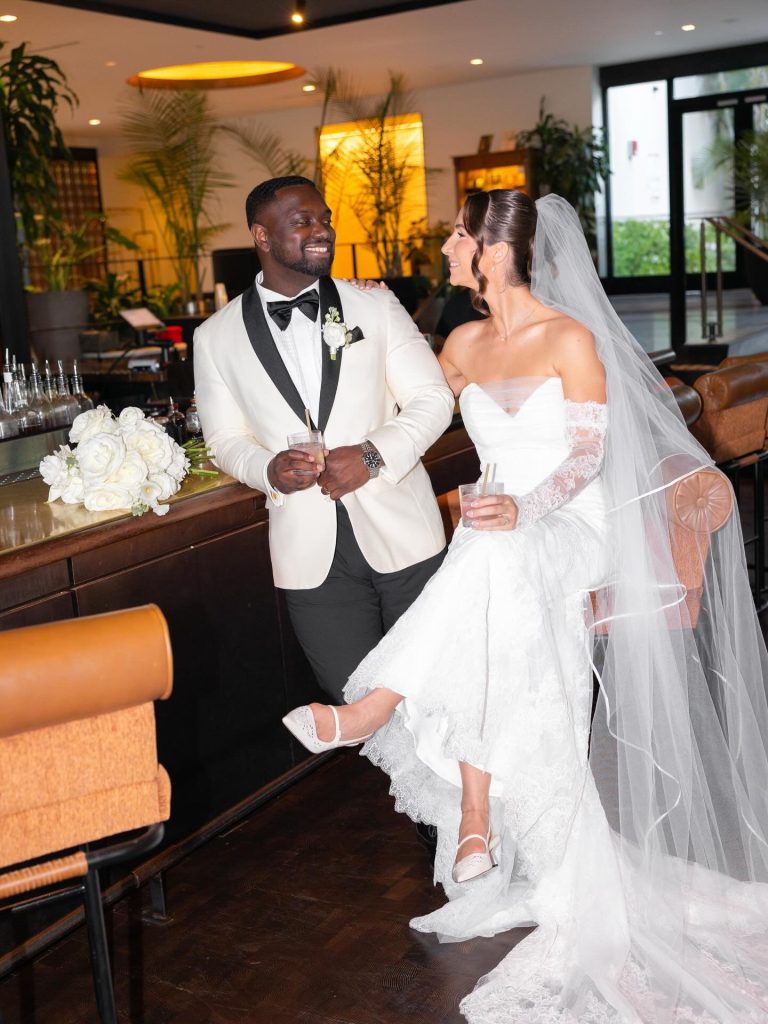 Bride and groom at bar inside hotel