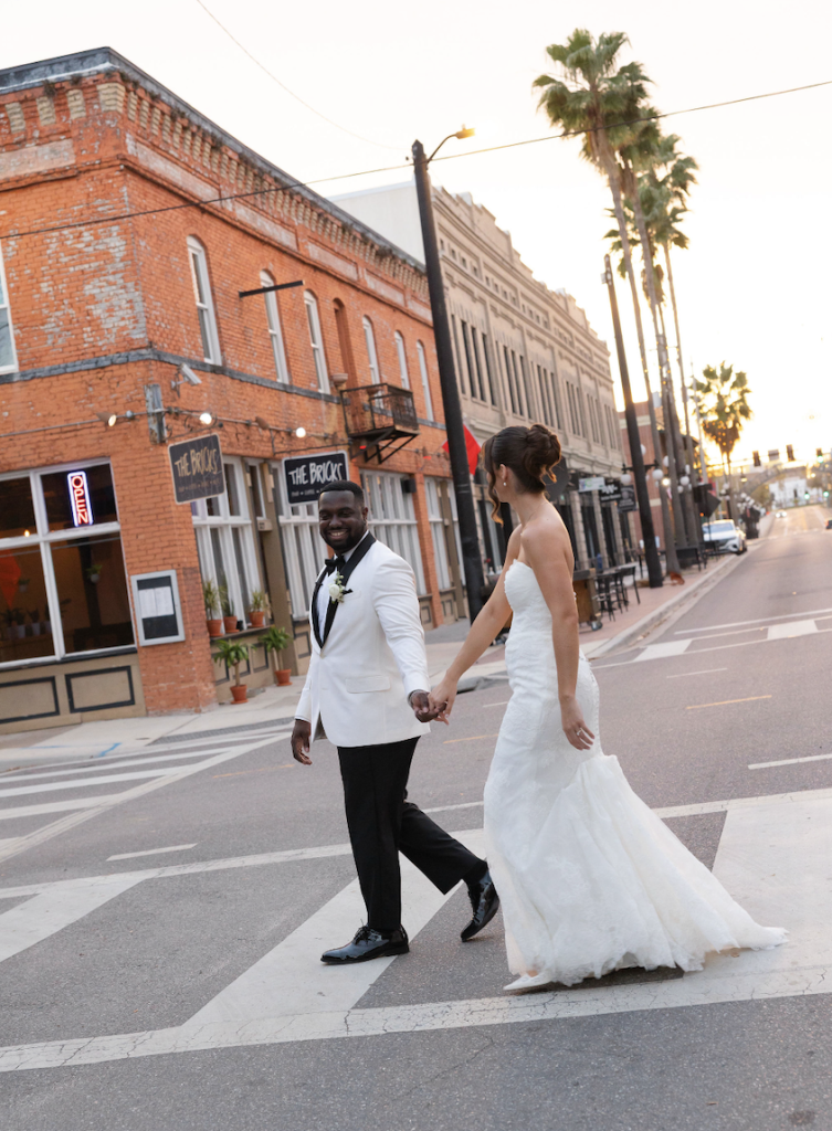 Bride and Groom holding hands in the street of Ybor City