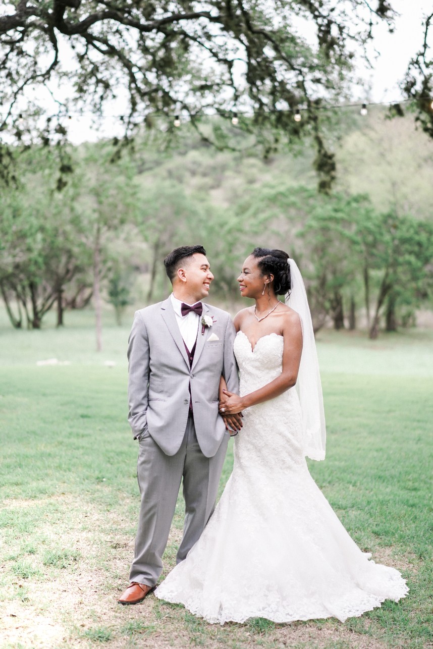 couple standing close together | tips on preparing a shot list for your photographer