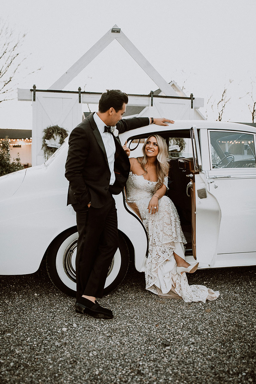 couple getting into getaway car + what to know before hiring a weddng videographer