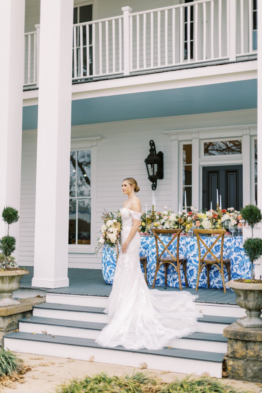bride standing on mansion steps