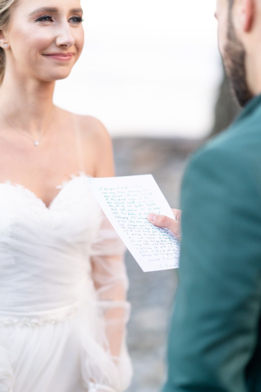 groom reading letter to bride