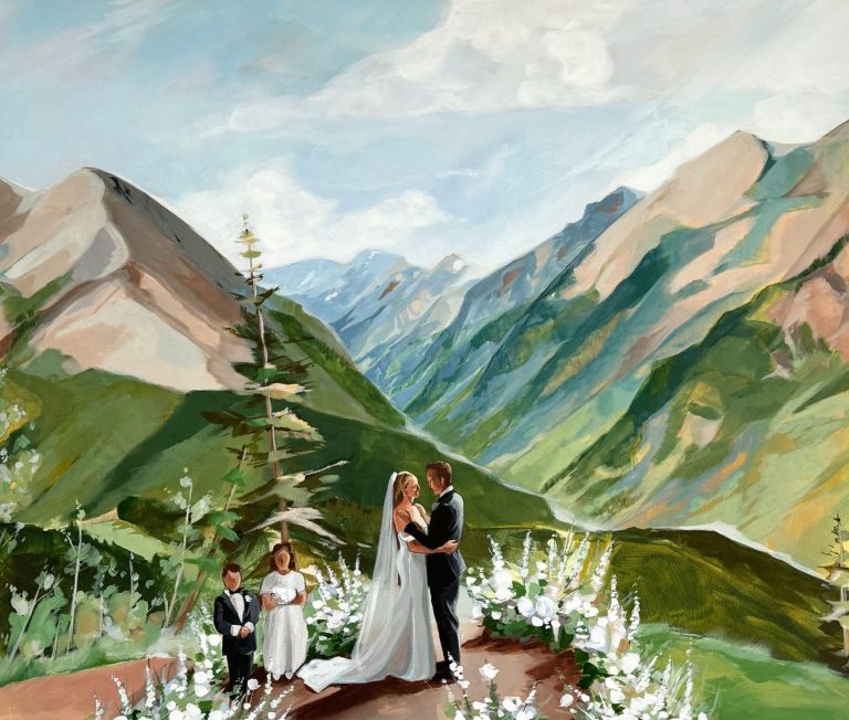 Painted mountain wedding ceremony with bride and groom exchanging vows among white floral arrangements and Colorado peaks