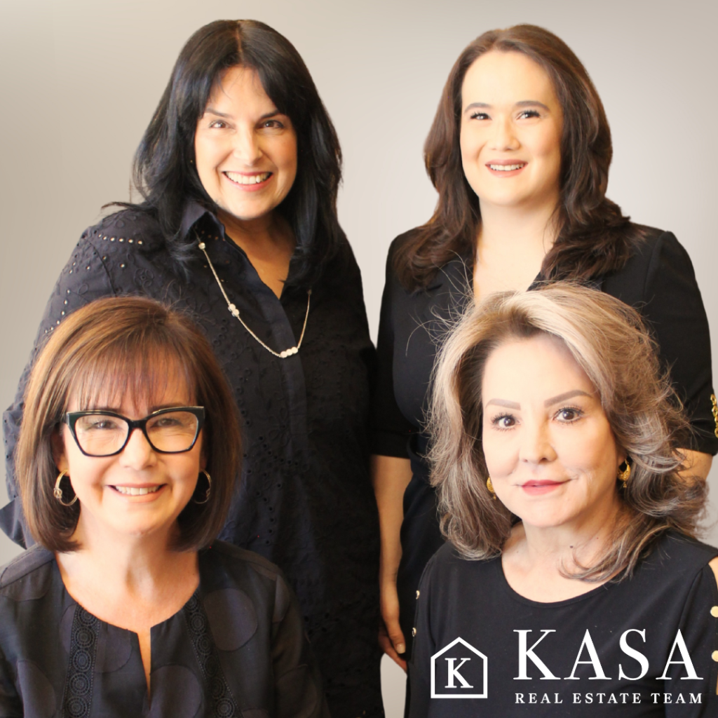 Newlyweds sharing first dance under woven pendant lights in modern industrial venue at Sunset Heights Co.