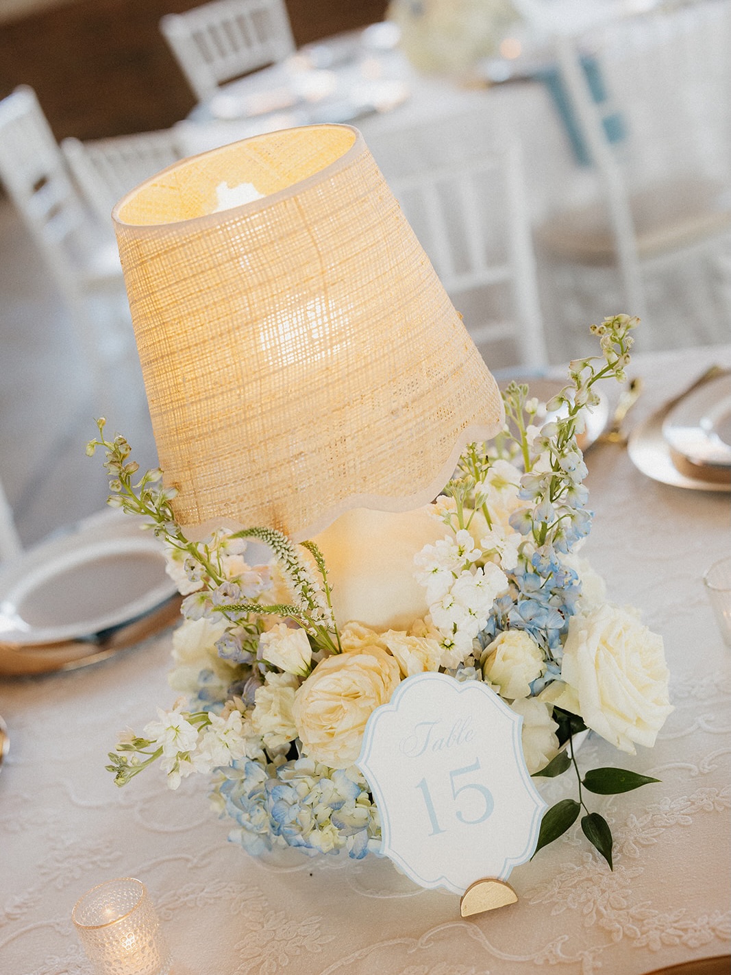 Table number centerpieces with blue and white florals
