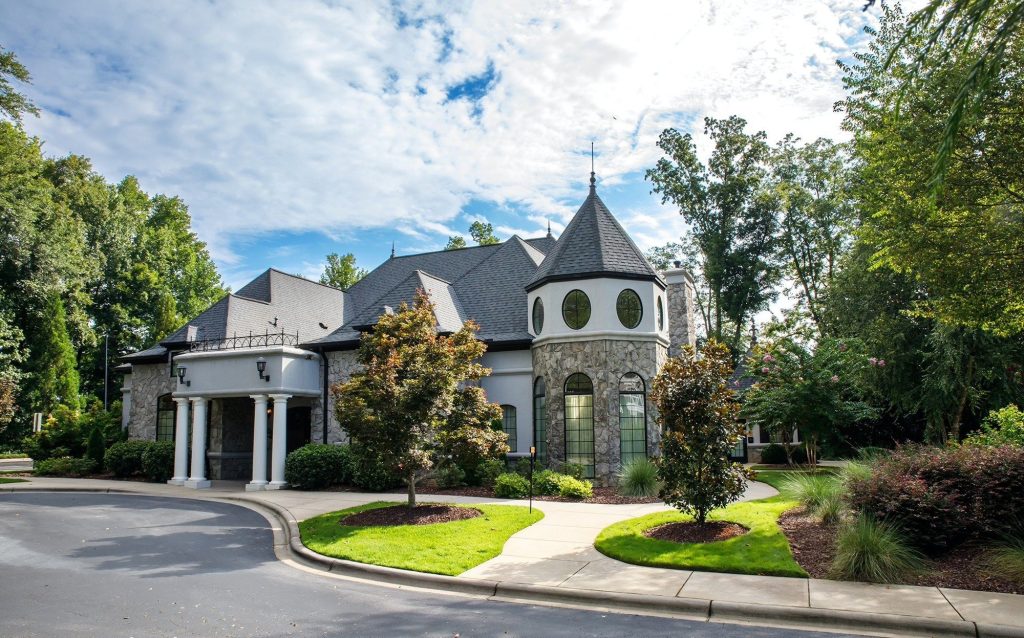 Elegant white stucco building with domed tower and ornate architecture at Riverwalk Event Venue in Charlotte
