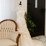 bridal gown next to a european style couch