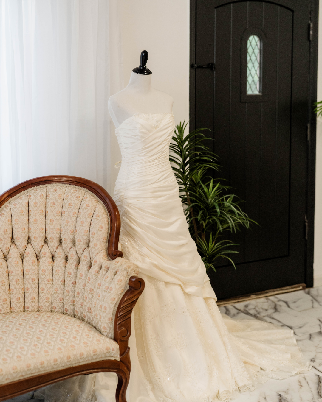 bridal gown next to a european style couch
