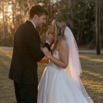 Bride and groom share intimate moment during golden hour in wooded Georgia setting