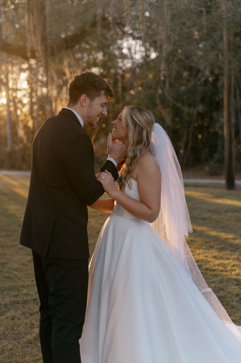 Bride and groom share intimate moment during golden hour in wooded Georgia setting