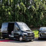 Black Mercedes sprinter van and Cadillac SUV on red carpet for wedding party transportation