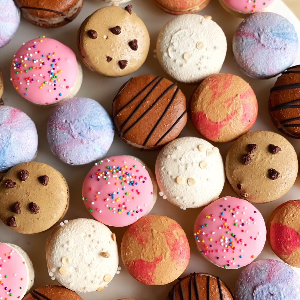 colorful wedding macaroons for dessert including pink with sprinkles and cookie dough macaroons