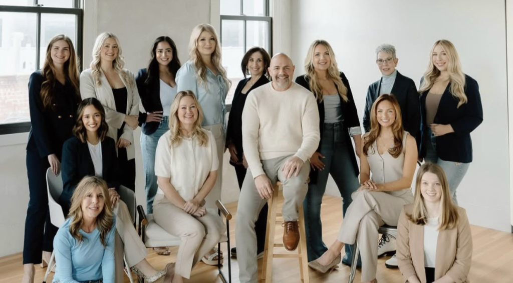 Professional team portrait of wedding planning staff in modern office space