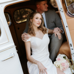 bride and groom in a getaway car