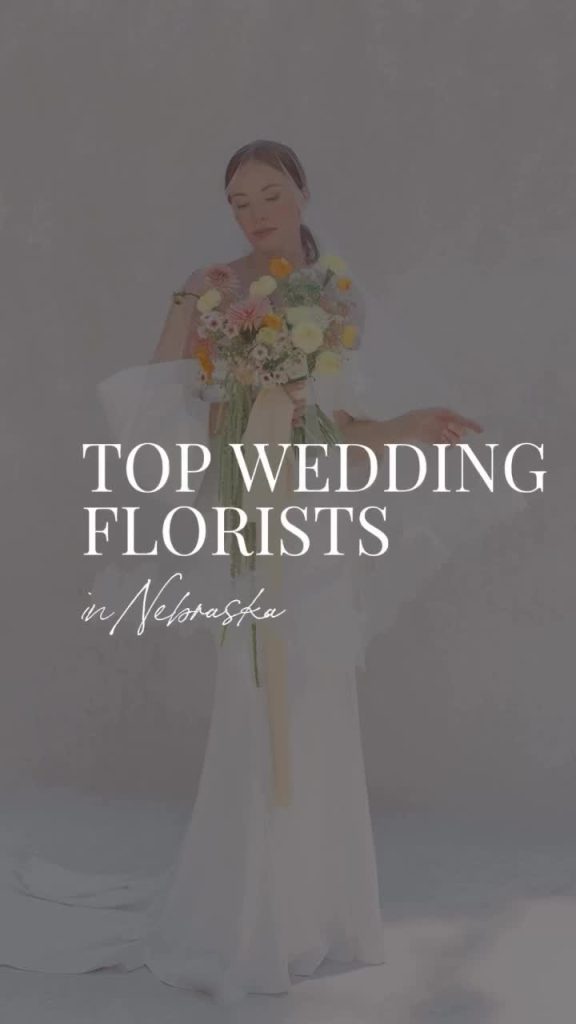 Bride holding yellow and cream wildflower bouquet in flowing wedding dress