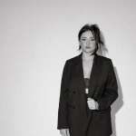 Anna K, Columbus wedding makeup artist, in oversized black blazer