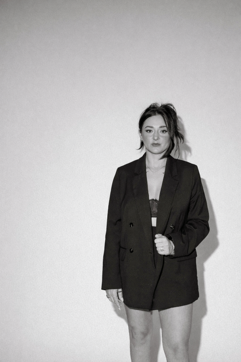 Anna K, Columbus wedding makeup artist, in oversized black blazer