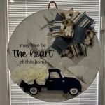 Round door hanger with truck design and text "Love has no speed limit to the heart of this family"