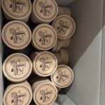 Wooden rounds with custom branded logos stacked together