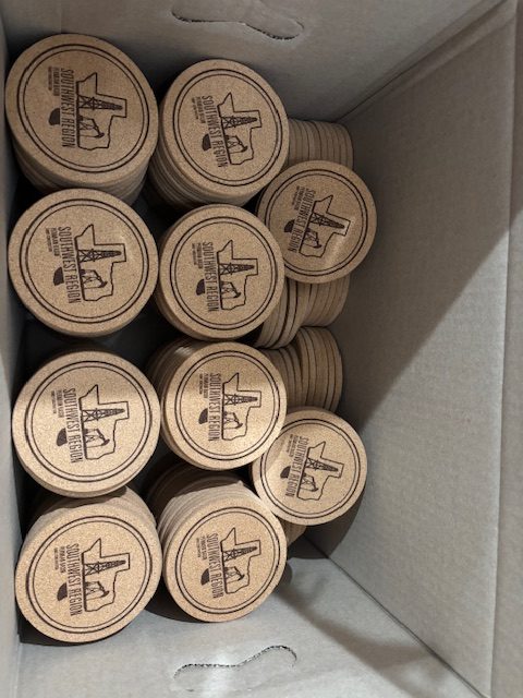 Wooden rounds with custom branded logos stacked together