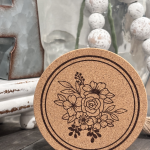 Cork coaster featuring engraved floral bouquet design with roses and daisies for wedding events