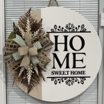 Round door hanger reading "Home Sweet Home" with neutral dried floral wreath and striped burlap bow