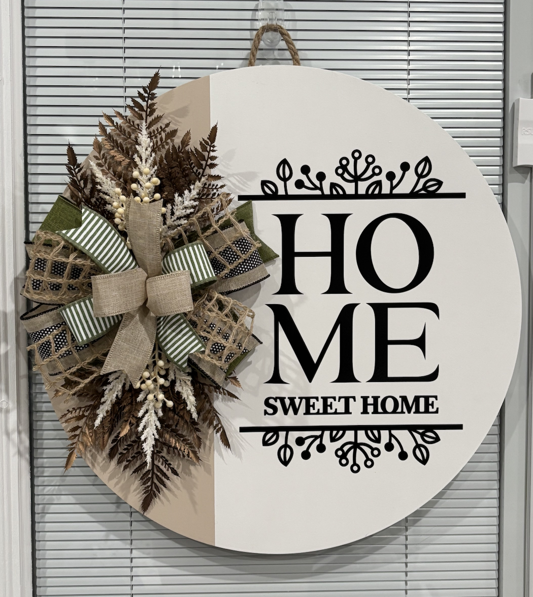 Round door hanger reading "Home Sweet Home" with neutral dried floral wreath and striped burlap bow