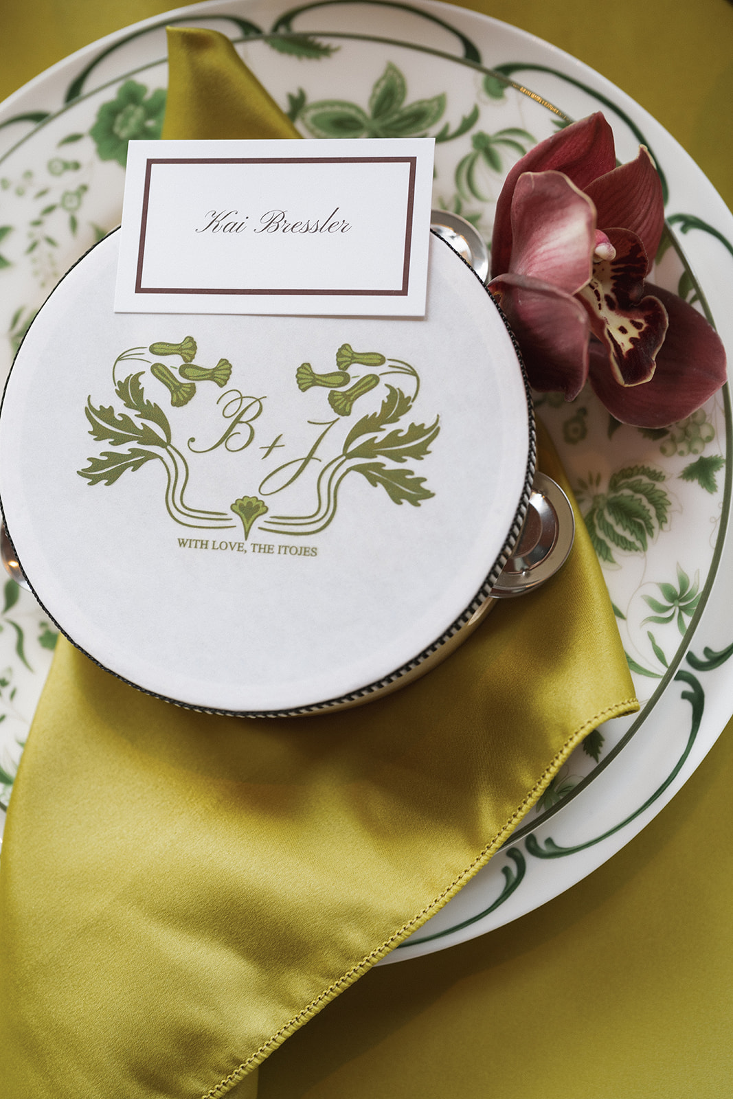 Wedding place setting with custom monogrammed coaster and burgundy orchid