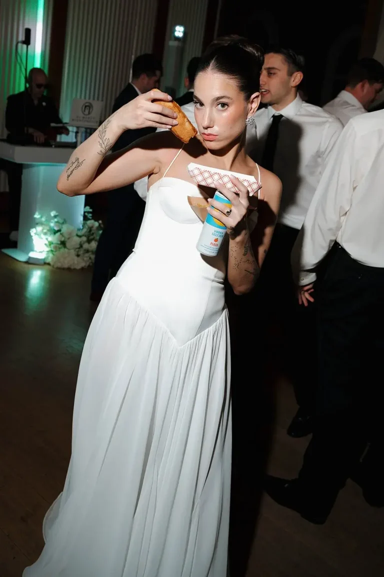 bride at reception having a late night snack