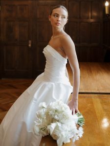 Stunning portraits of bride indoors with all white bridal bouquet