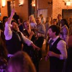 Wedding reception dance floor with guests enjoying live entertainment