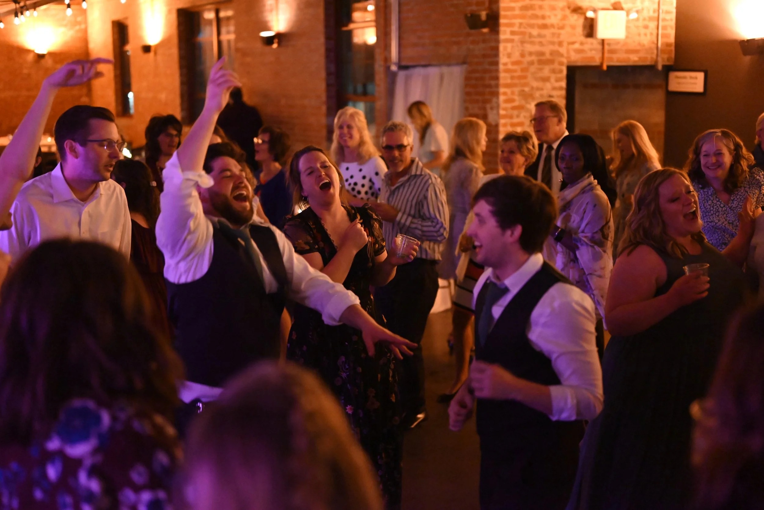 Wedding reception dance floor with guests enjoying live entertainment