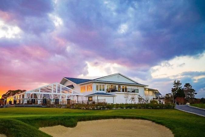 Luxury event venue in South Jersey featuring contemporary architecture and manicured grounds at sunset