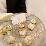 Lobster mochi bites with sticky rice and yuzu sauce on a decorative glass tray