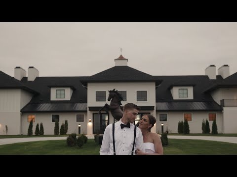 Wedding couple walking in front of upscale venue building