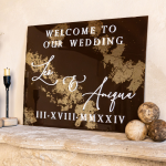 Personalized wedding welcome sign with brown and gold leaf design displaying couple's names and date on ornate stone mantel