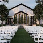 Outdoor wedding ceremony setup at Lincoln-area barn venue with contemporary design and vertical garden accent