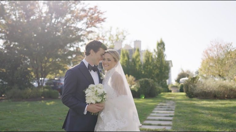 Couple sharing intimate moment in garden setting with white bridal bouquet