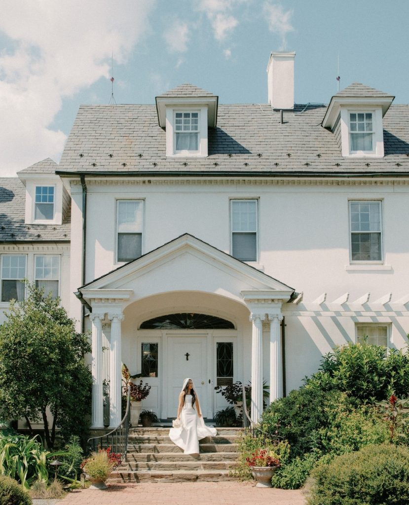 Bride standing in front of historic wedding venue in northern virginia