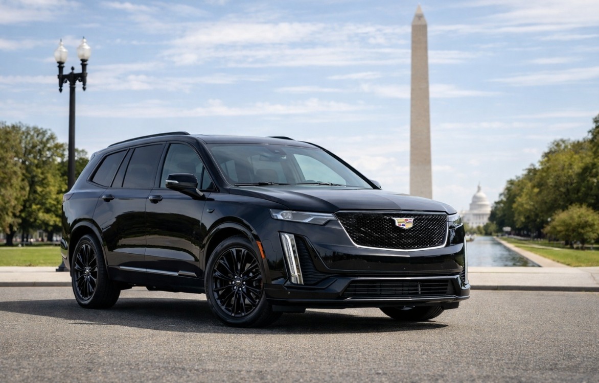Black Cadillac Escalade on National Mall with Washington Monument and U.S. Capitol visible