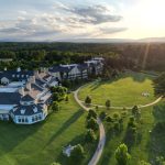 Aerial view of Northern Virginia wedding venue estate surrounded by rolling hills at sunset
