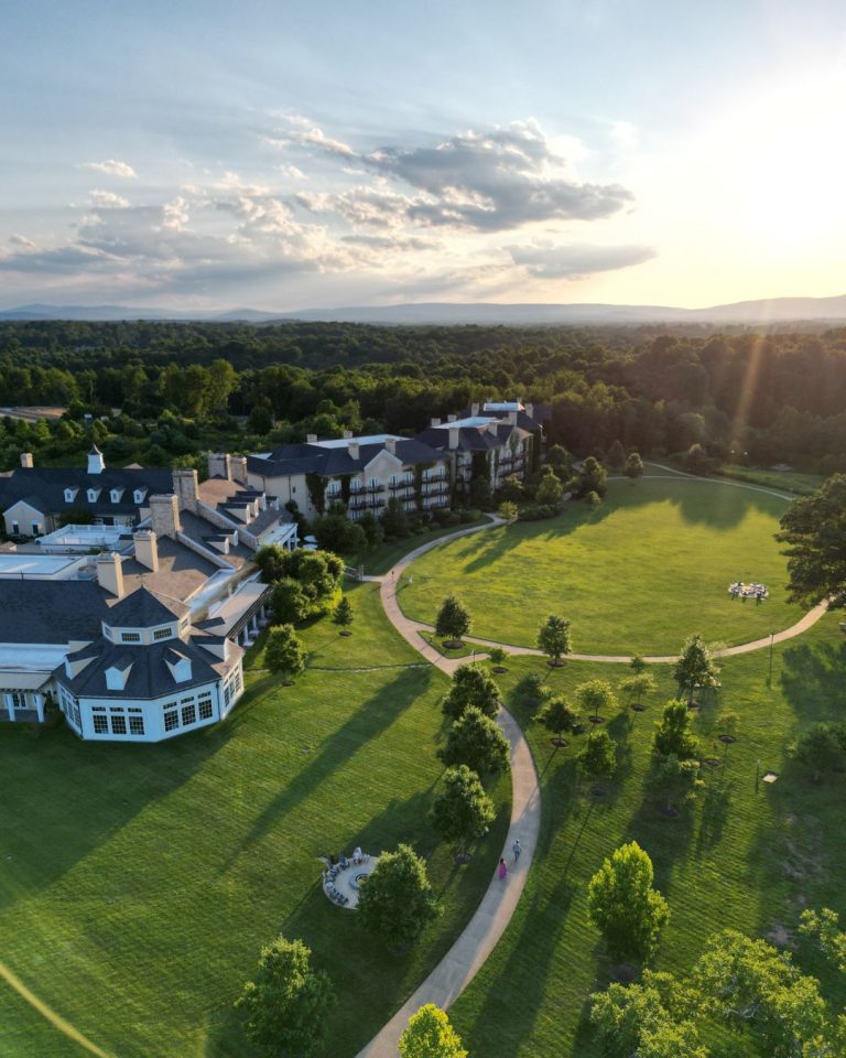 Aerial view of Northern Virginia wedding venue estate surrounded by rolling hills at sunset