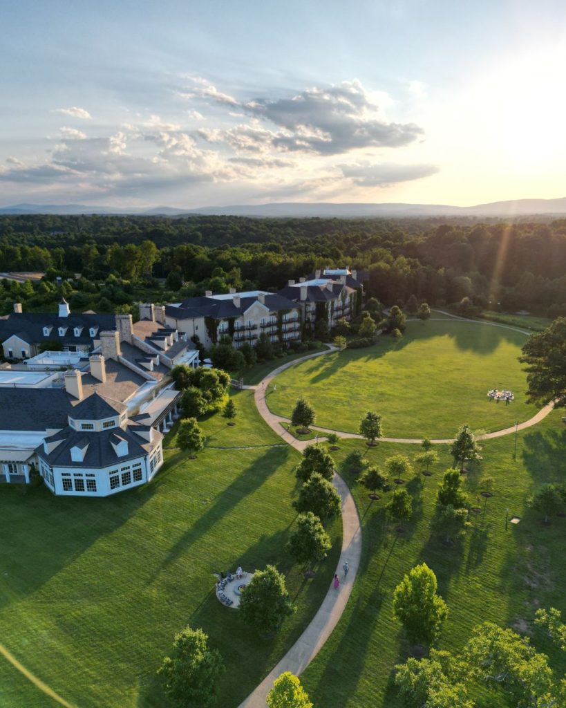 Aerial view of Northern Virginia wedding venue estate surrounded by rolling hills at sunset