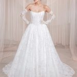 Strapless corset ballgown with allover lace, detachable off-shoulder lace sleeves, and chapel train