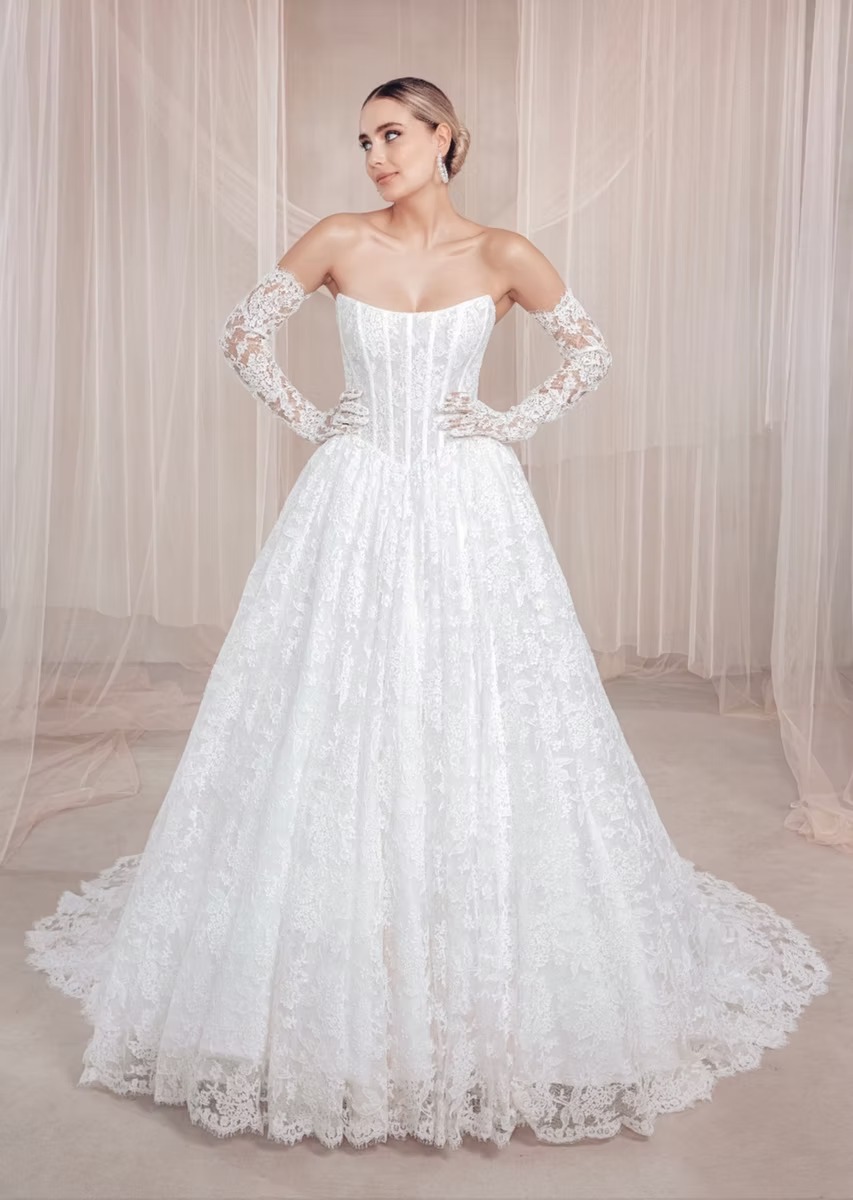 Strapless corset ballgown with allover lace, detachable off-shoulder lace sleeves, and chapel train